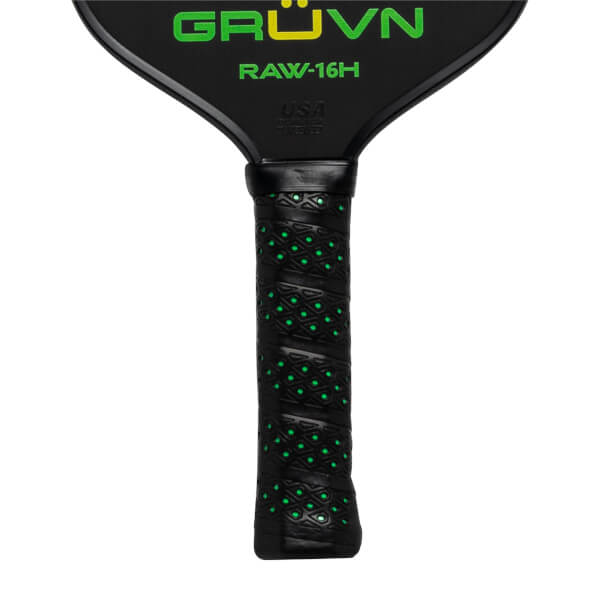 Top-down view of a black GRUVN RAW-16H pickleball paddle with green text and a textured grip.