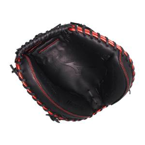 Top-down view of a black baseball catchers mitt with red stitching and Mizuno branding.