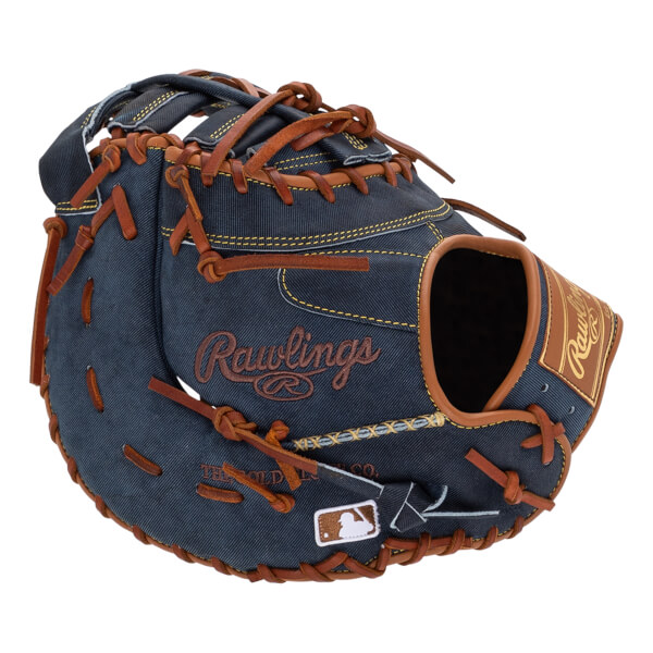 Front view of a blue denim baseball mitt with brown lacing and Rawlings branding.