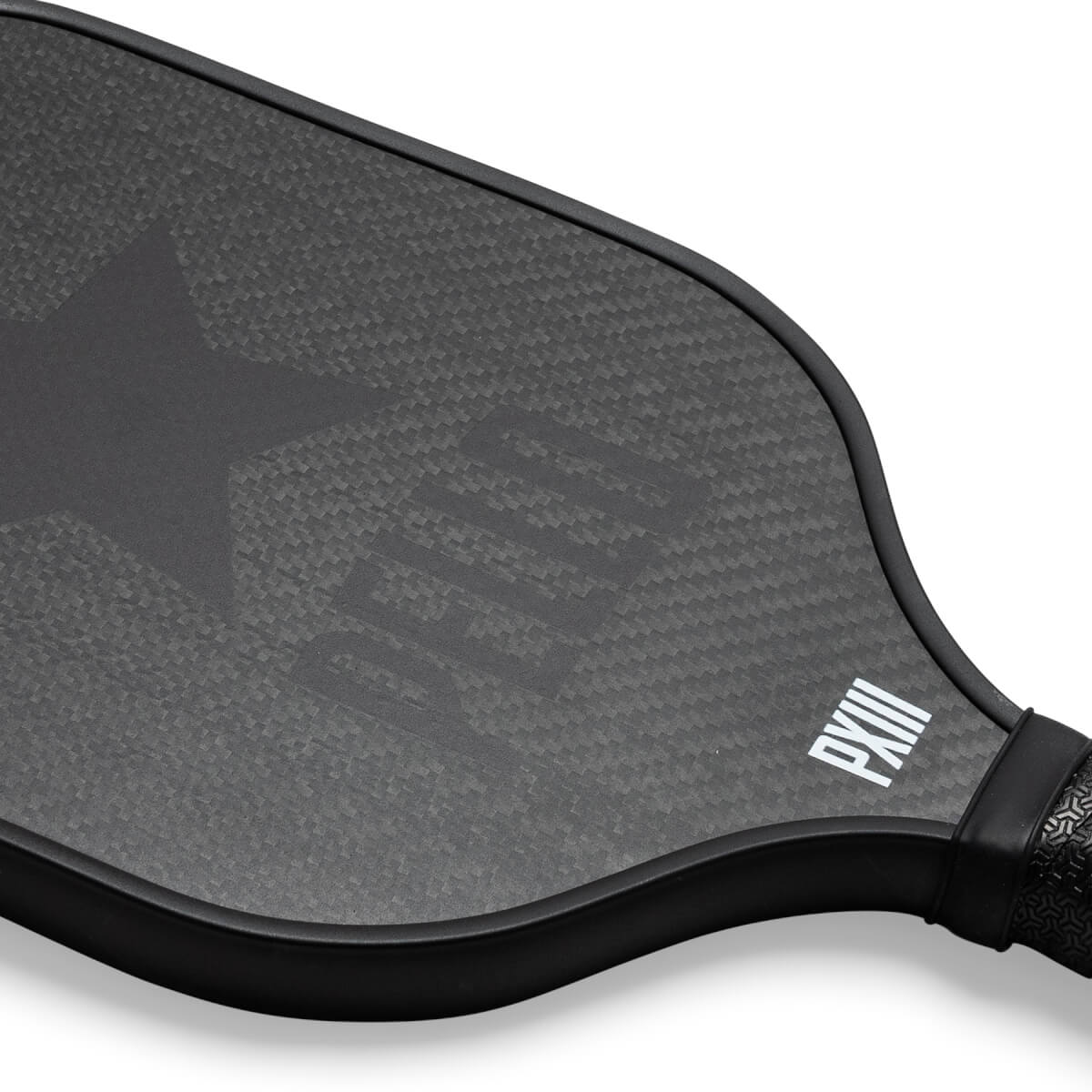 Corner view of a black carbon fiber pickleball paddle with a star logo and PXIII text.