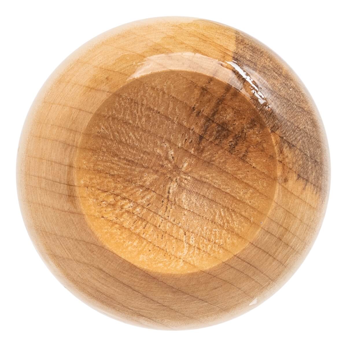 Top-down view of a natural wood baseball bat end with circular wood grain and a smooth, glossy surface.
