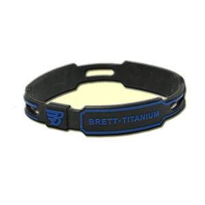 Close-up of a black bracelet with blue accents and BRETT TITANIUM text.