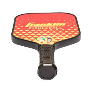 Top-down view of a red pickleball paddle with a yellow diamond pattern, Franklin Pickleball text, and cartoon faces.