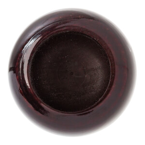 Top-down view of a dark brown wood baseball bat with a concave end and faint circular markings.