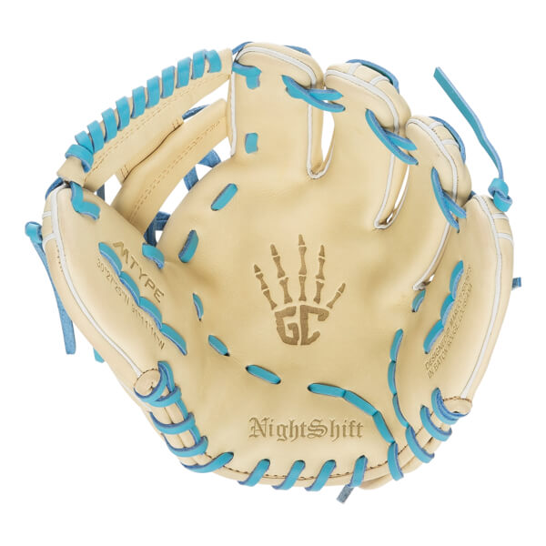 Top-down view of a tan baseball glove with blue lacing, a skeleton hand logo, and NightShift text.