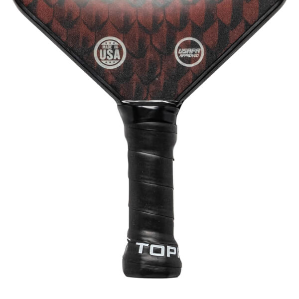 Top-down view of a black pickleball paddle with red scale pattern, MADE IN USA and USAPA APPROVED logos.