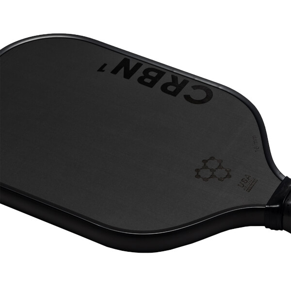 Corner view of a black pickleball paddle with CRBN 1 branding and a USA Pickleball logo.