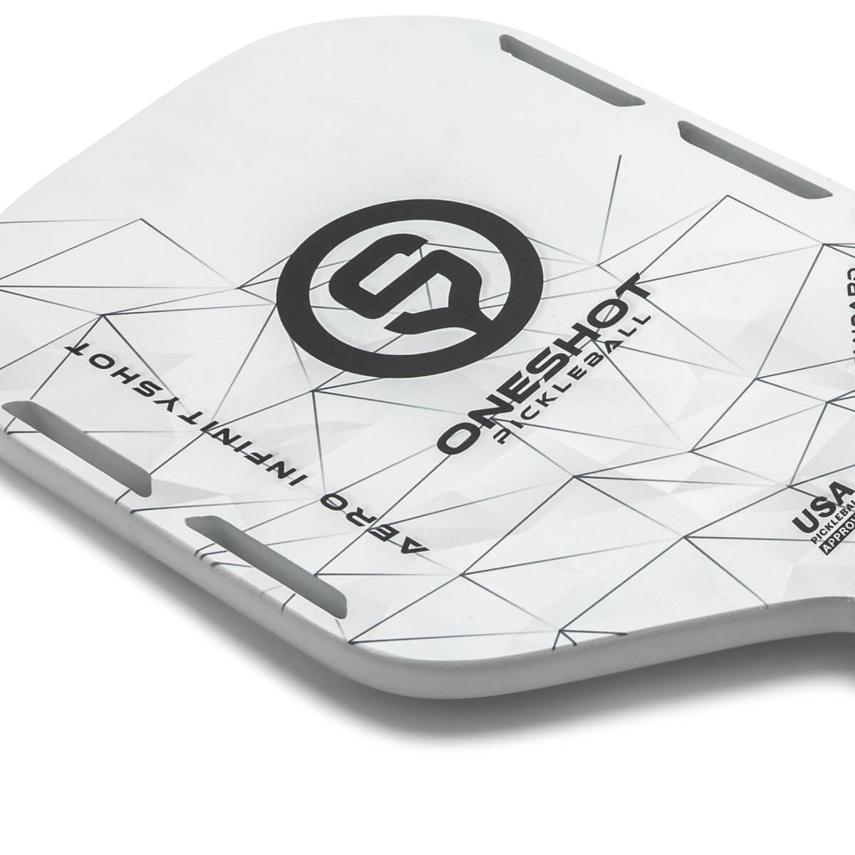 Corner view of a white pickleball paddle with a black logo, geometric pattern, and text.