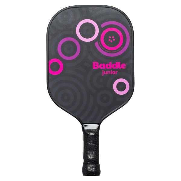 Front view of a black Baddle Junior pickleball paddle with pink circles and a textured grip.