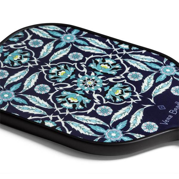 Corner view of a navy pickleball paddle with a floral pattern and Vera Bradley text.