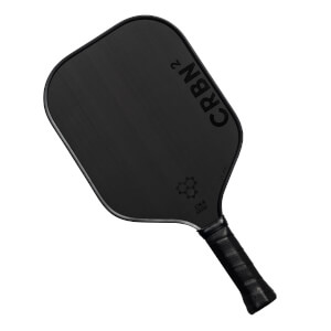 Top-down view of a black pickleball paddle with CRBN² branding and a honeycomb logo.