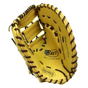Inside view of a yellow first base mitt with Brett logo, Pro Legend Series text, and Premium stamp.