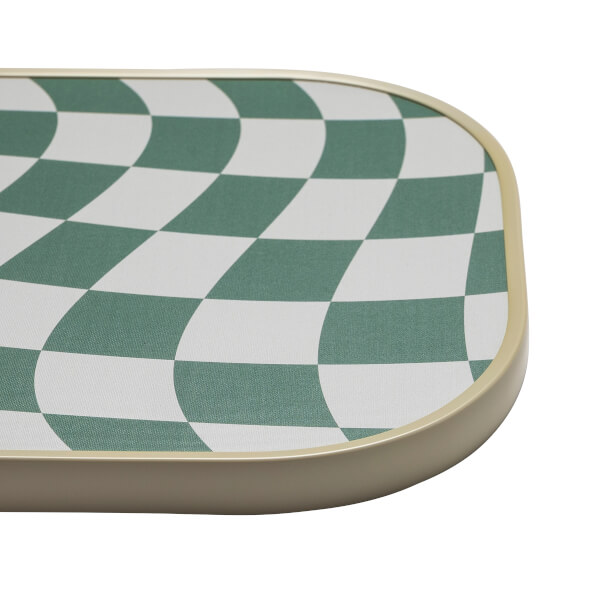 Corner view of a pickleball paddle with a green and white warped checkerboard pattern and a tan edge.