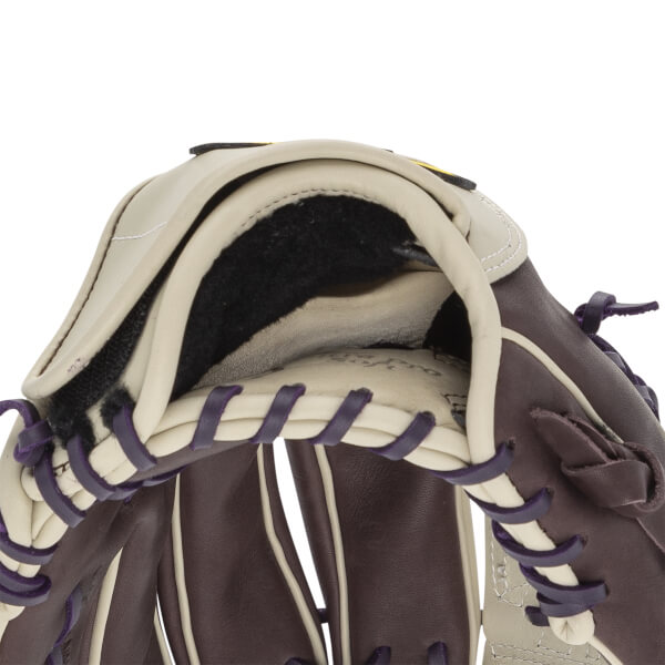 Close-up of a brown and tan softball glove with purple lacing and black lining.