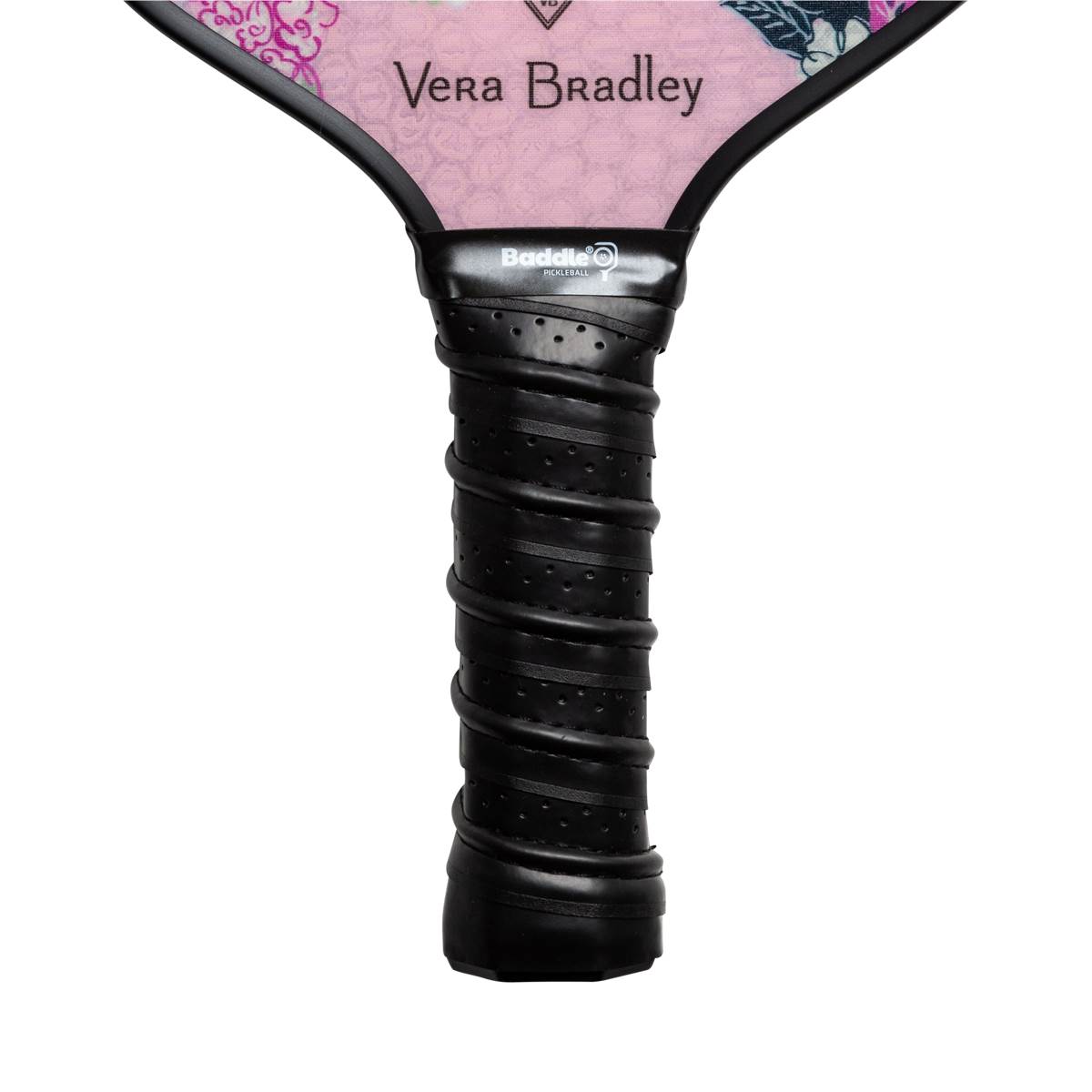 Close-up of a black pickleball paddle grip with Baddle logo and pink Vera Bradley patterned head.