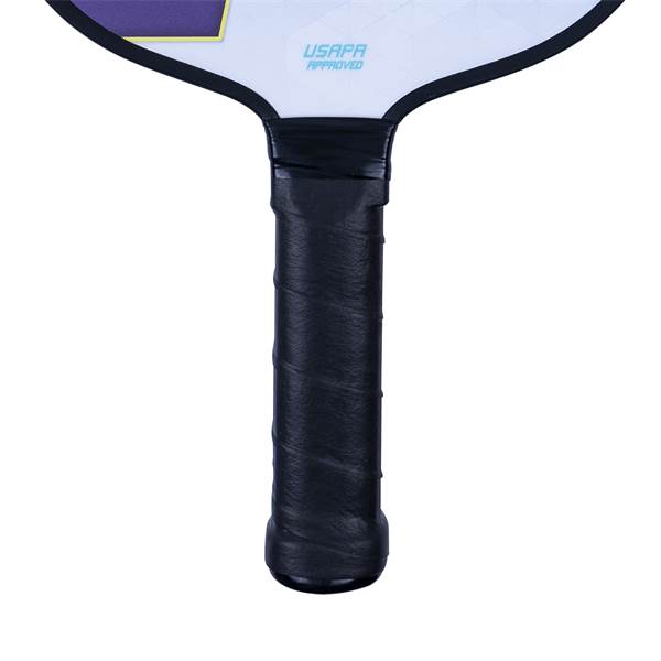 Close-up of a black pickleball paddle grip with USAPA APPROVED text on the paddle head.