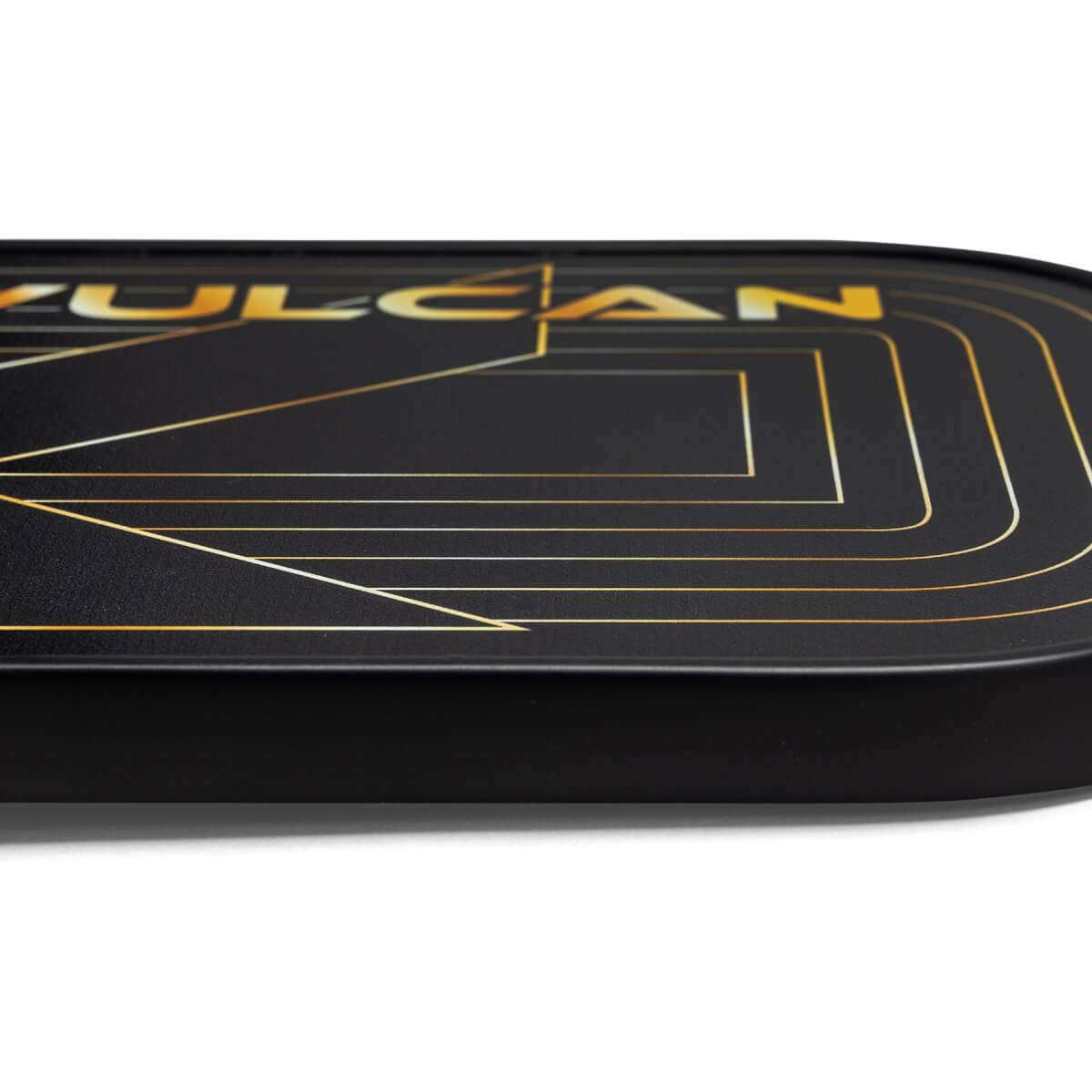 Side view of a black pickleball paddle with gold VULCAN text and geometric lines.