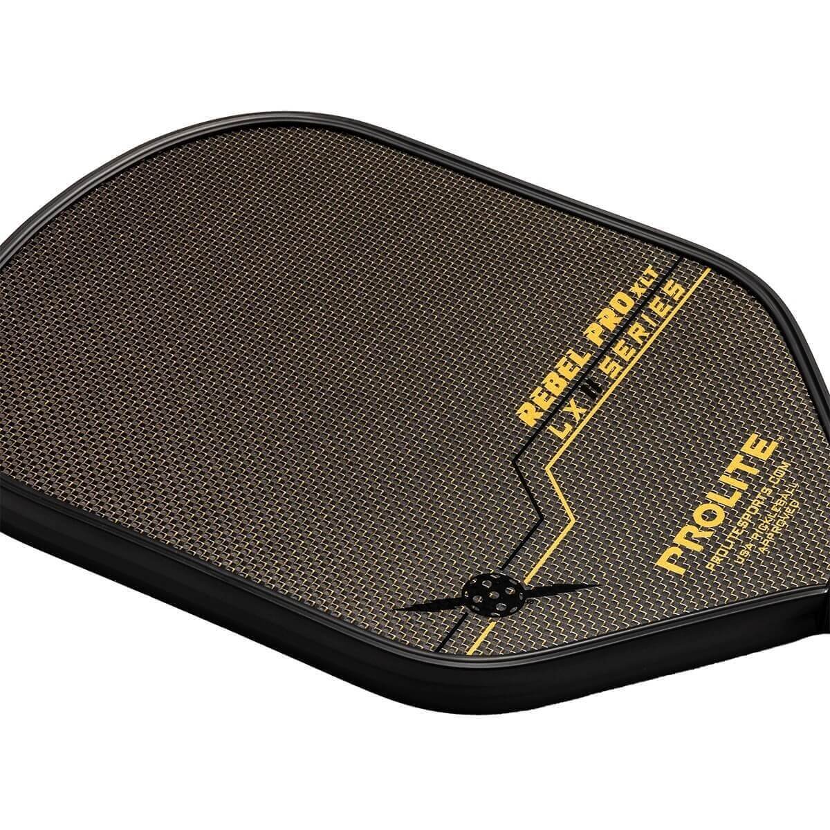 Top-down view of a black pickleball paddle with a textured surface, yellow REBEL PRO XLT LX II SERIES text, and PROLITE logo.