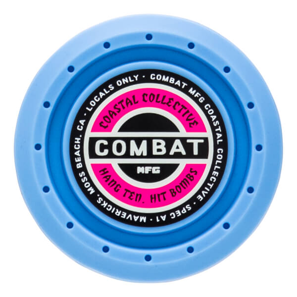 Top-down view of a blue circular product with "COMBAT" in large white letters on a pink and black label.
