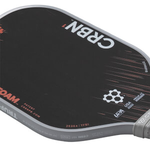 Angled view of a black CRBN¹ TruFoam pickleball paddle with white logo, Barrage text, and grey edge guard.