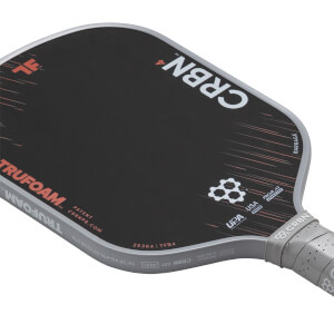 Angled view of a black and grey pickleball paddle with CRBN4, TRUFOAM branding, and a geometric pattern.