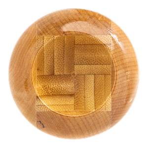 Top-down view of a natural wood baseball bat end showing a square bamboo-weave core and maple wood grain ring.