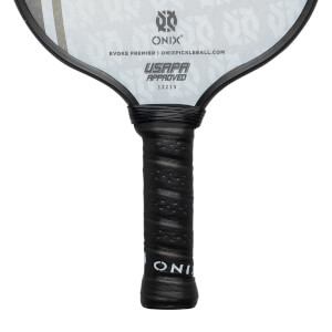 Close-up of a black pickleball paddle grip with perforated texture and ONIX branding.