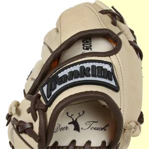 Close-up of a tan baseball glove with brown lacing, a Franklin logo patch, and Deer Touch text.
