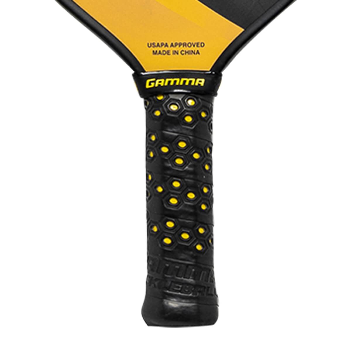 Close-up of a black pickleball paddle grip with yellow honeycomb pattern and GAMMA logo.