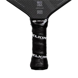 Close-up of a black pickleball paddle grip with white ELKIR branding and a textured surface.