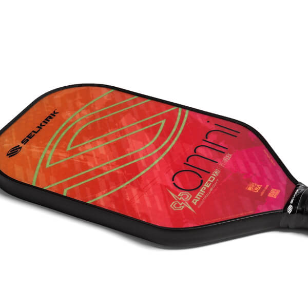 Top-down view of a red and orange pickleball paddle with green lines and Omni text.