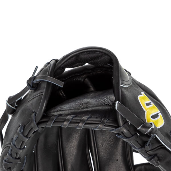 Close-up of the hand opening on the black leather glove, featuring thick interior padding and a yellow and white Wilson W logo embroidered on the wrist strap.
