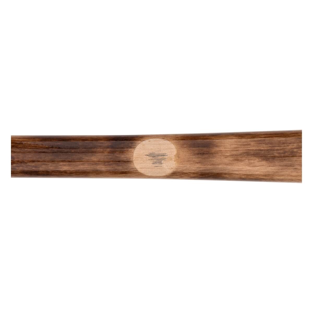 Close-up of a brown baseball bat with a dark wood grain and a light circular patch with vertical lines.