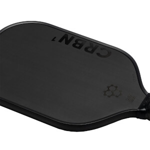 Close-up of a black CRBN pickleball paddle with CRBN 7 and a honeycomb logo.