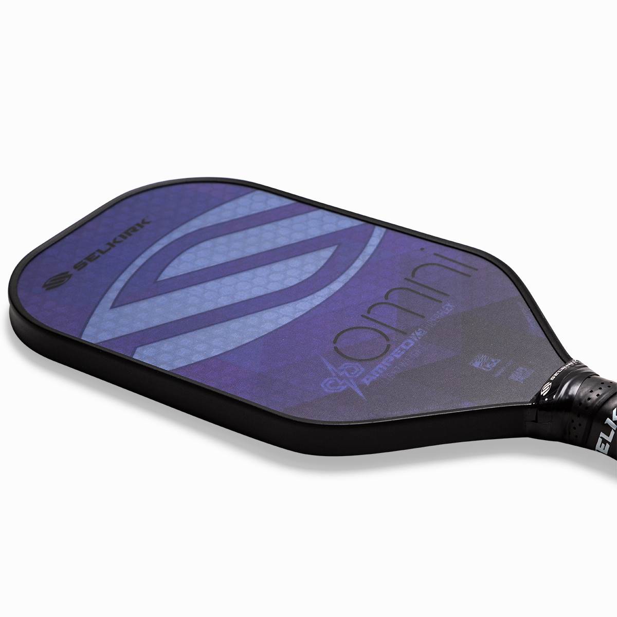 Top-down view of a purple pickleball paddle with a Selkirk logo and omni text.
