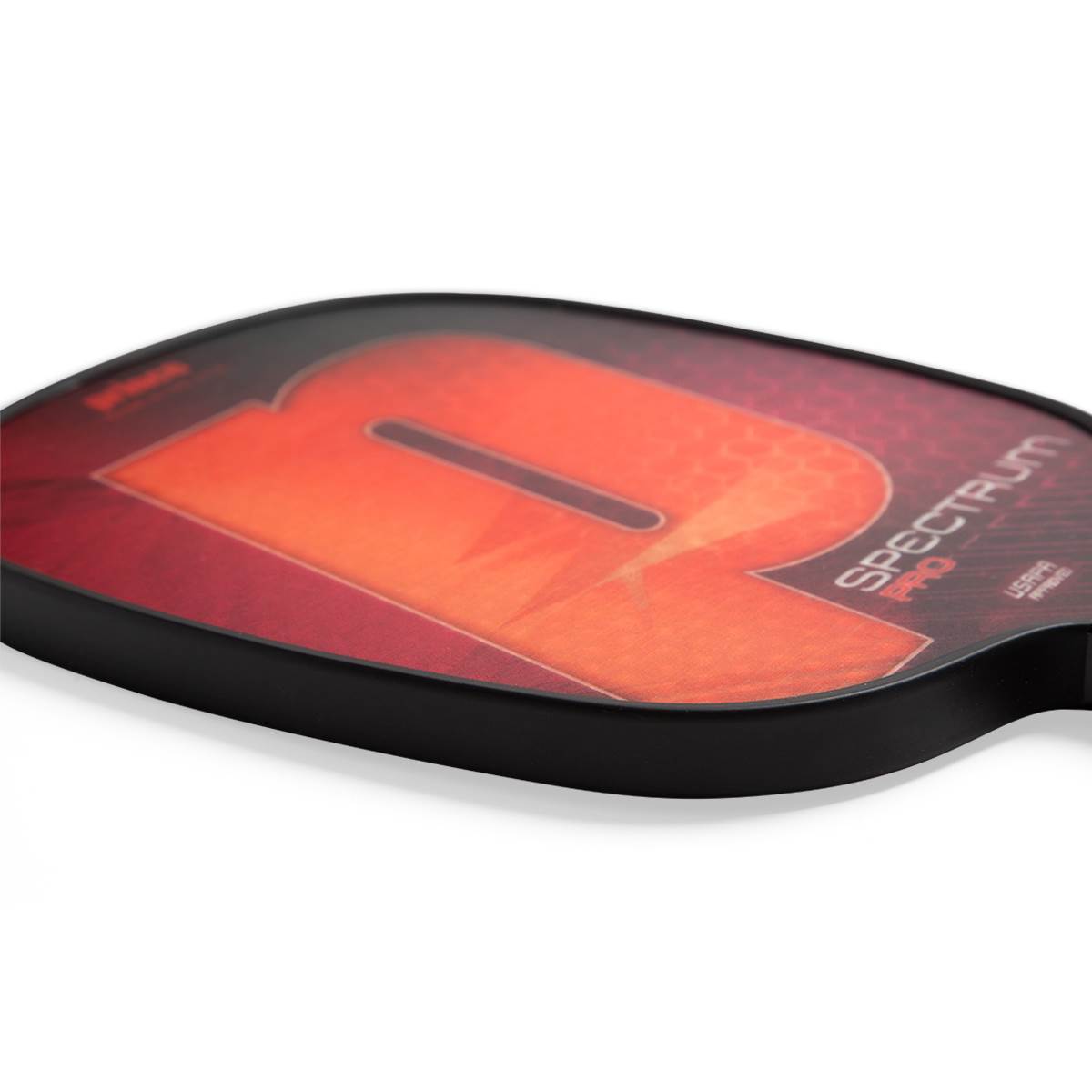 Side view of a red and orange pickleball paddle with a large R graphic and SPECTRUM PRO text.