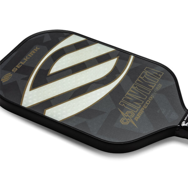 Top-down view of a black pickleball paddle with a large white S graphic and INVINKTA text.