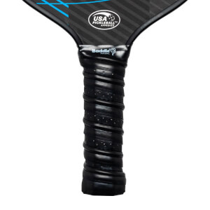 Close-up of a black pickleball paddle grip with Baddle logo and USA Pickleball Approved seal.
