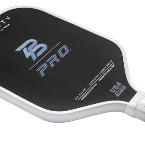 Corner view of a black pickleball paddle with B PRO logo and USA PICKLEBALL APPROVED text.