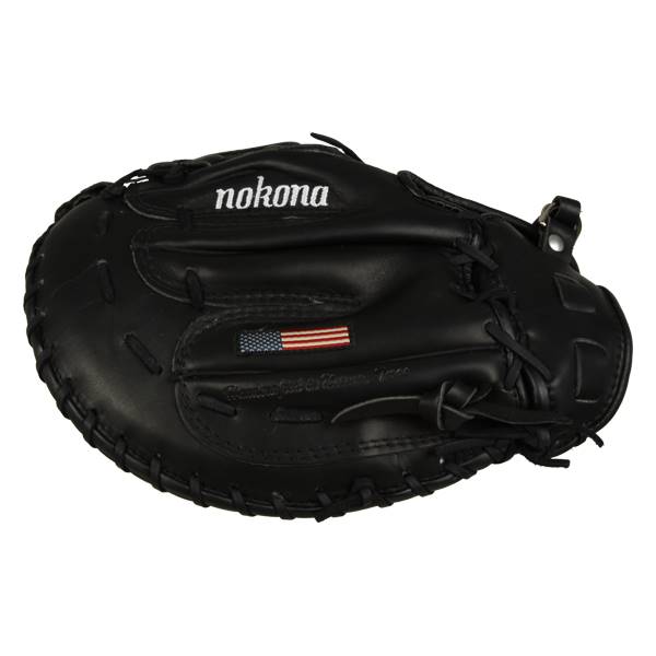 Top-down view of a black first base mitt with nokona branding and an American flag patch.