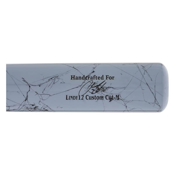 Side view of a grey baseball bat with black marbling, a signature, and LINDY12 Custom Cut-M text.