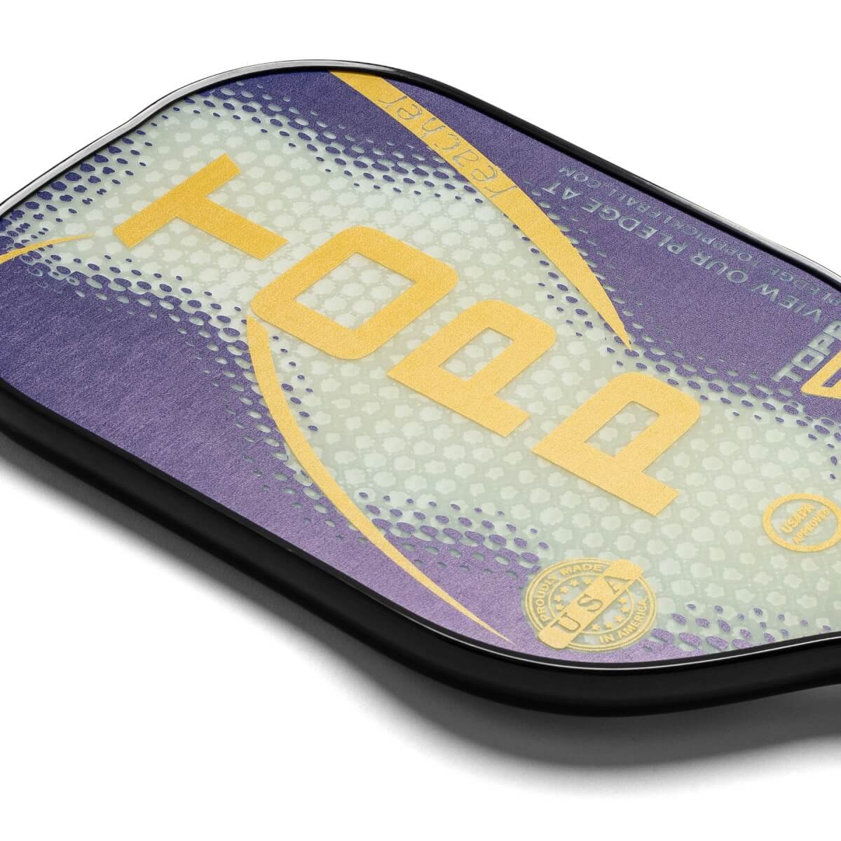 Corner view of a purple and white pickleball paddle with yellow TOPP lettering and a Proudly Made USA seal.