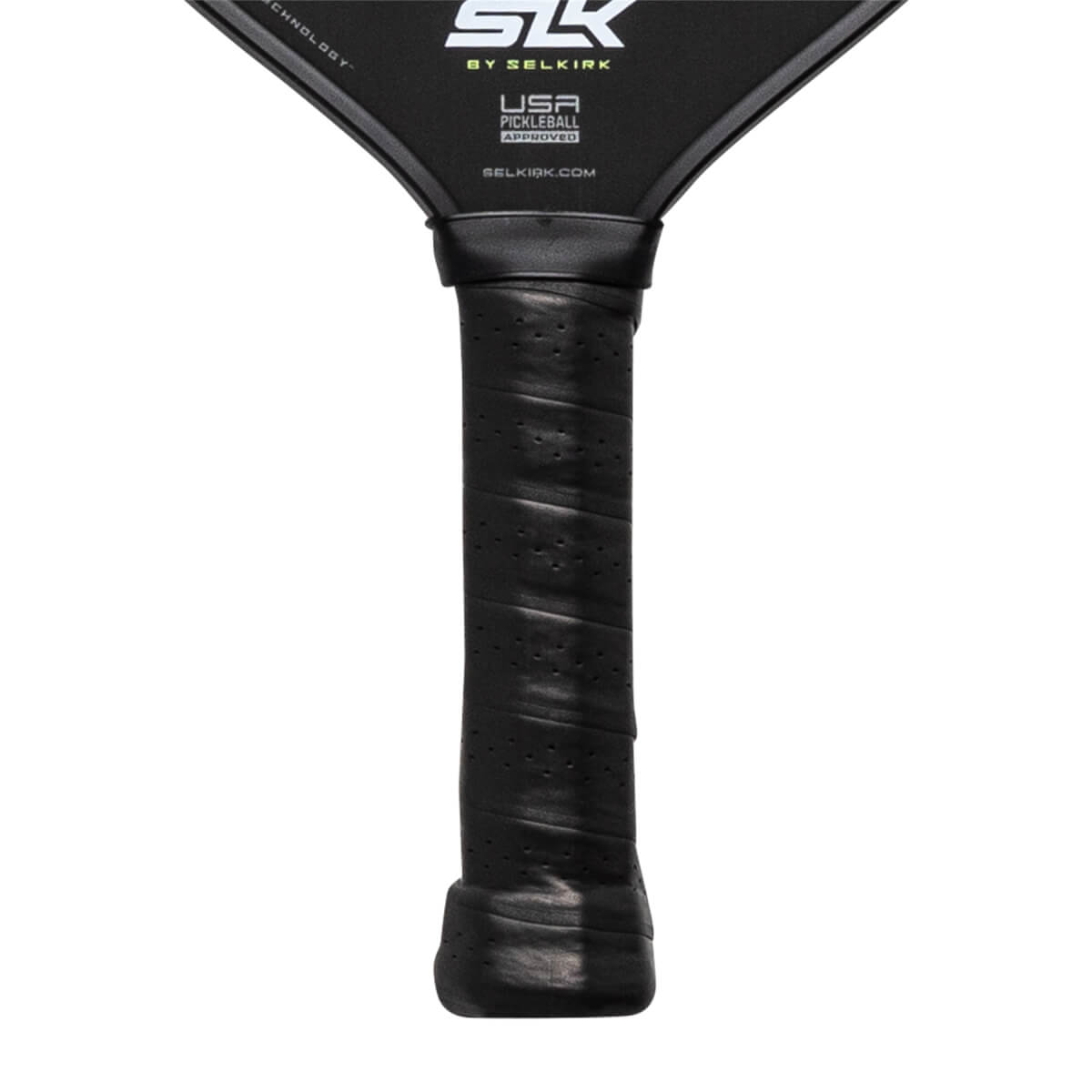 Close-up of a black pickleball paddle grip with perforations and the Selkirk logo.