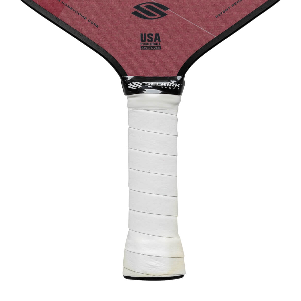 Top-down view of a red pickleball paddle with a white grip and USA PICKLEBALL APPROVED text.