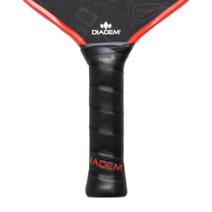 Close-up of a black pickleball paddle with a textured grip, red trim, and DIADEM logo.