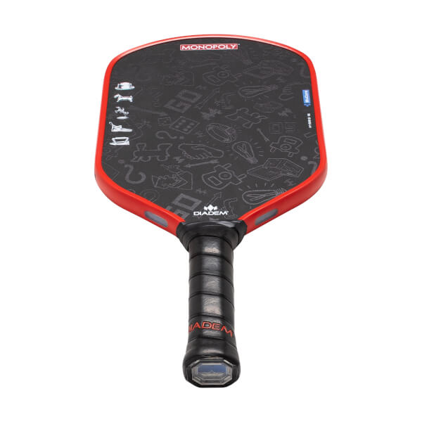 Front view of a black pickleball paddle with red trim, Monopoly-themed doodles, and a black grip with red Diadem branding.