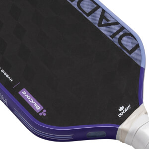 Close-up view of a black and purple pickleball paddle with BluCore text, grid-pattern DIADEM, and HYBRID text.