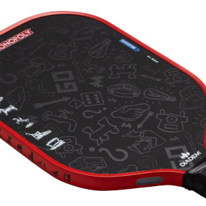 Angled close-up of a black Diadem pickleball paddle with grey Monopoly patterns and a red edge guard.