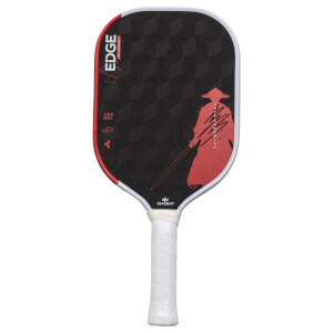 Front view of a black pickleball paddle with a red samurai graphic, "EDGE BLUCORE" text, and a white grip.
