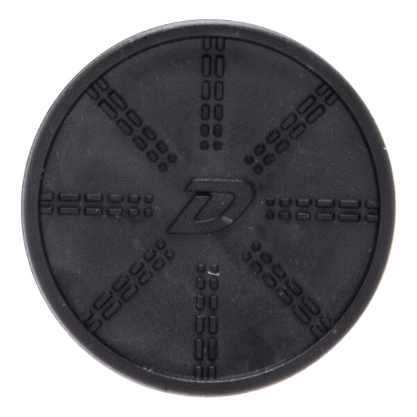 Top-down view of a circular black rubber disc featuring a stylized "D" in the center surrounded by eight radial patterns of embossed dashed lines.